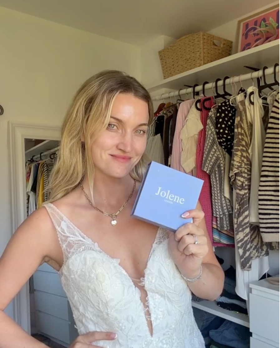 Woman holding a blue Jolene box